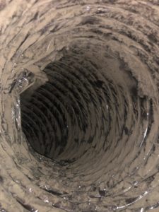Picture showing dirt on the inside of an air duct before cleaning