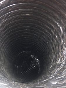Picture showing the inside of an air duct cleaned with no debris in the vent