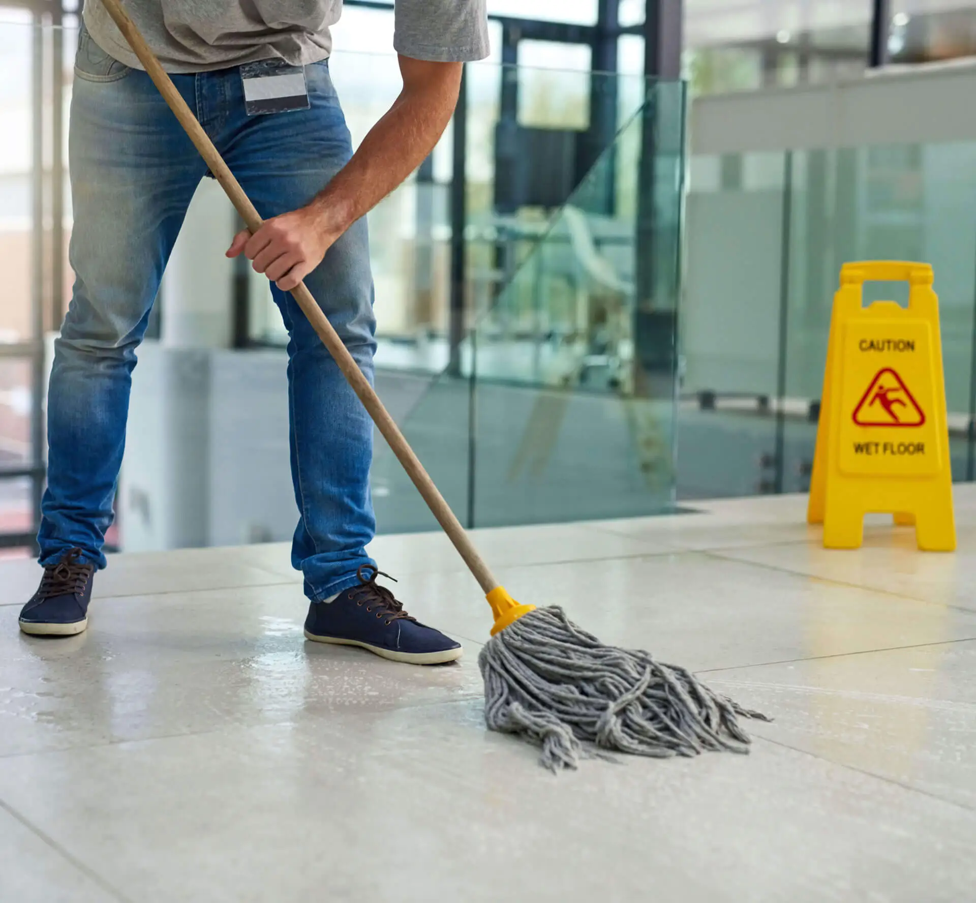 Man mopping a tile floor