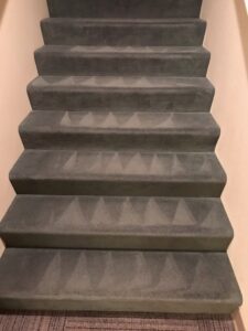 Carpeted stairs after cleaning using a steam carpet cleaning system