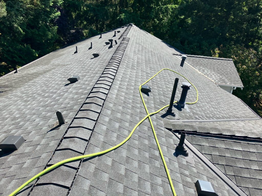Multifamily roof being cleaned.