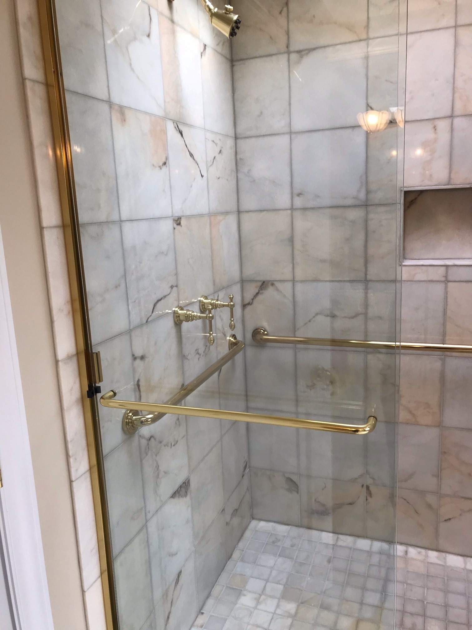 Marble shower tile and ground after professional cleaning