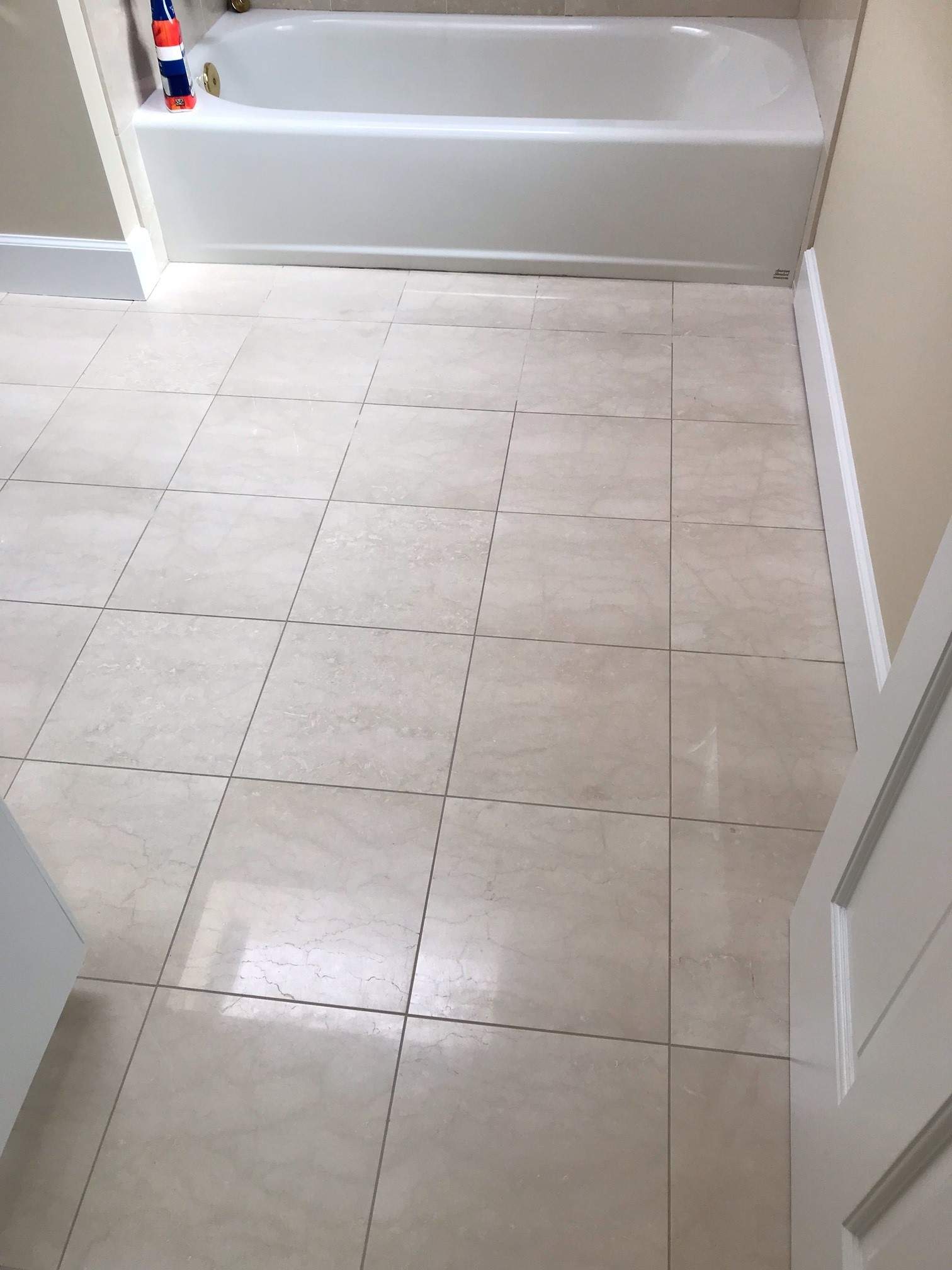 Clean bathroom tile and grout lines after cleaning